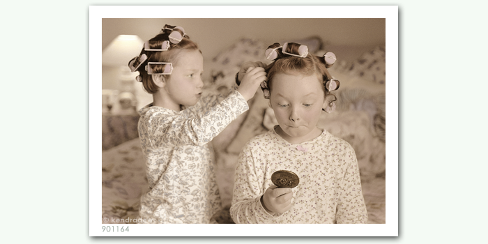 photograph of girls in curlers
