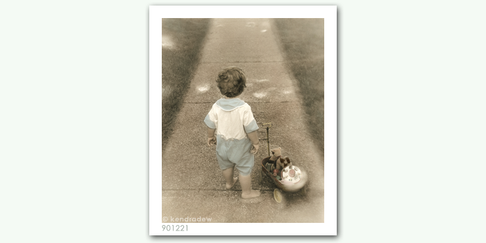 photograph of boy with wagon
