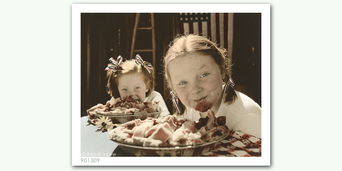 photograph of girls eating pie