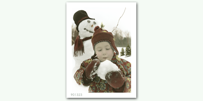 photograph of girl with snowman