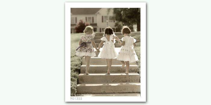 photograph of girls in dresses ascending stairs