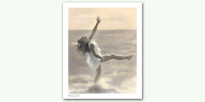 photograph of girl dancing in water