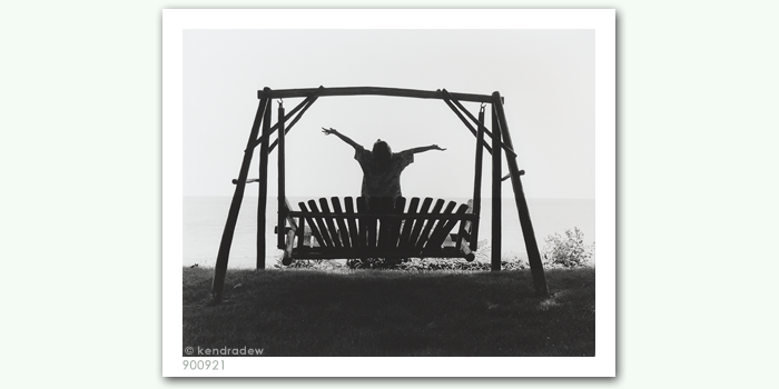 photograph of boy on swing