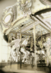 photograph of girls on carousel
