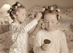 photograph of girls in curlers