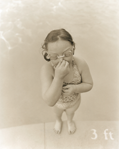 photograph of girl by swimming pool