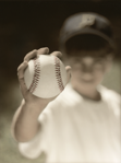 photograph of boy with baseball
