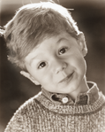 photograph of boy in sweater