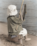 photograph of boy fishing
